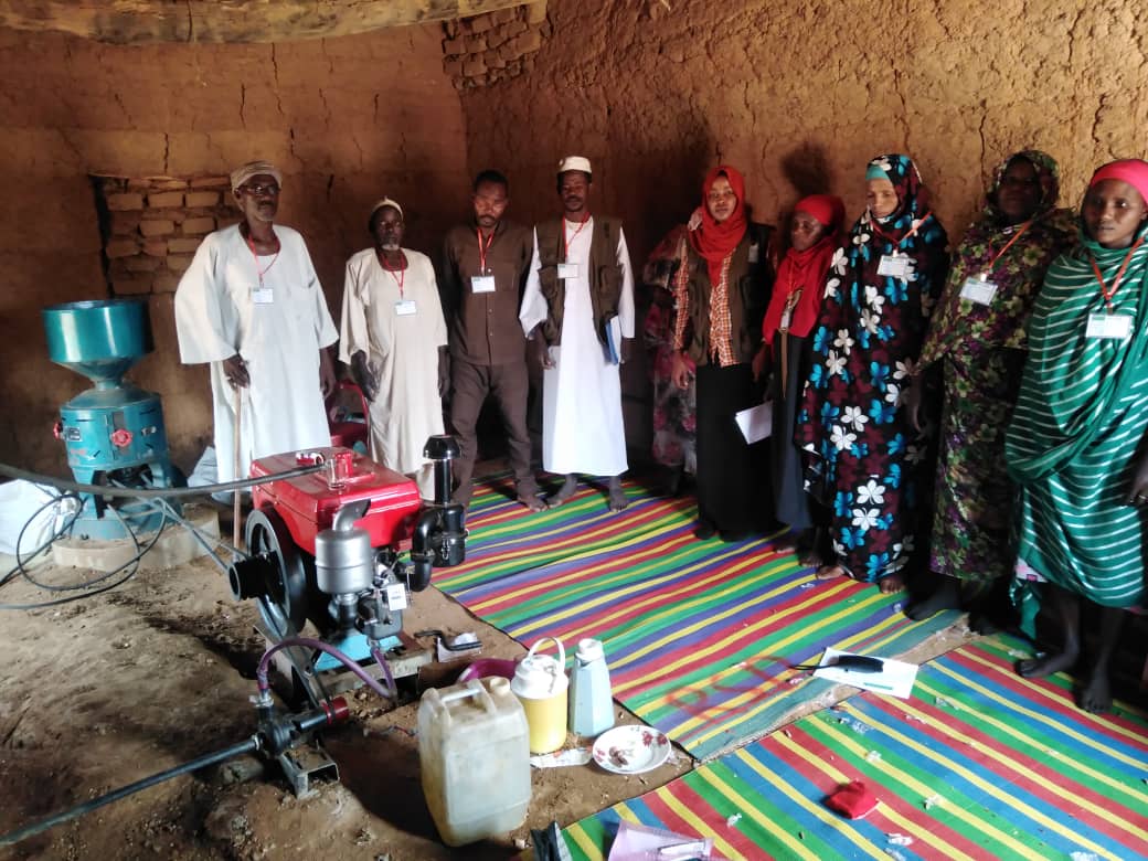 Distribution of Grain (Sorghum/Millet) to the Women's Committee in Hila Keneen, Kutum