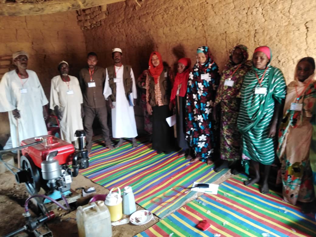 Distribution of Grain (Sorghum/Millet) to the Women's Committee in Hila Keneen, Kutum