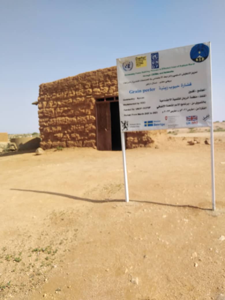 Distribution of Grain (Sorghum/Millet) to the Women's Committee in Hila Keneen, Kutum